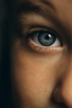 Close-up of a person's eye, representing God's intentional design of humanity.