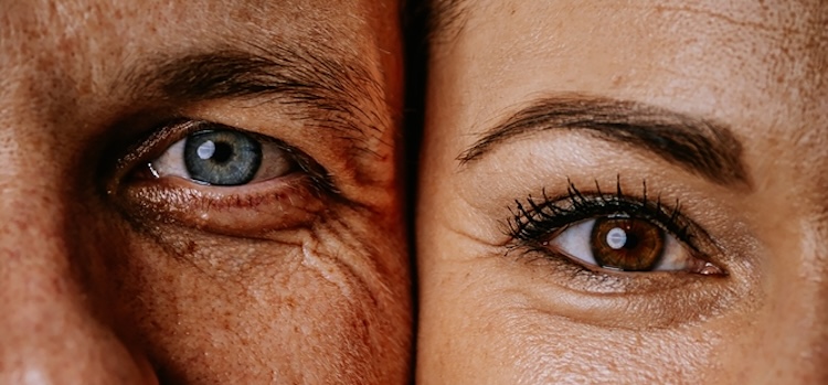 A close-up of a man's blue eye on the left and a woman's brown eye on the right.