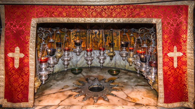 Exterior view of the Holy Church of the Nativity in Bethlehem, Israel, an ancient stone basilica traditionally recognized as the birthplace of Jesus.