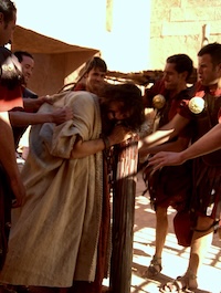 Jesus is scourged by Roman soldiers prior to his crucifixion.