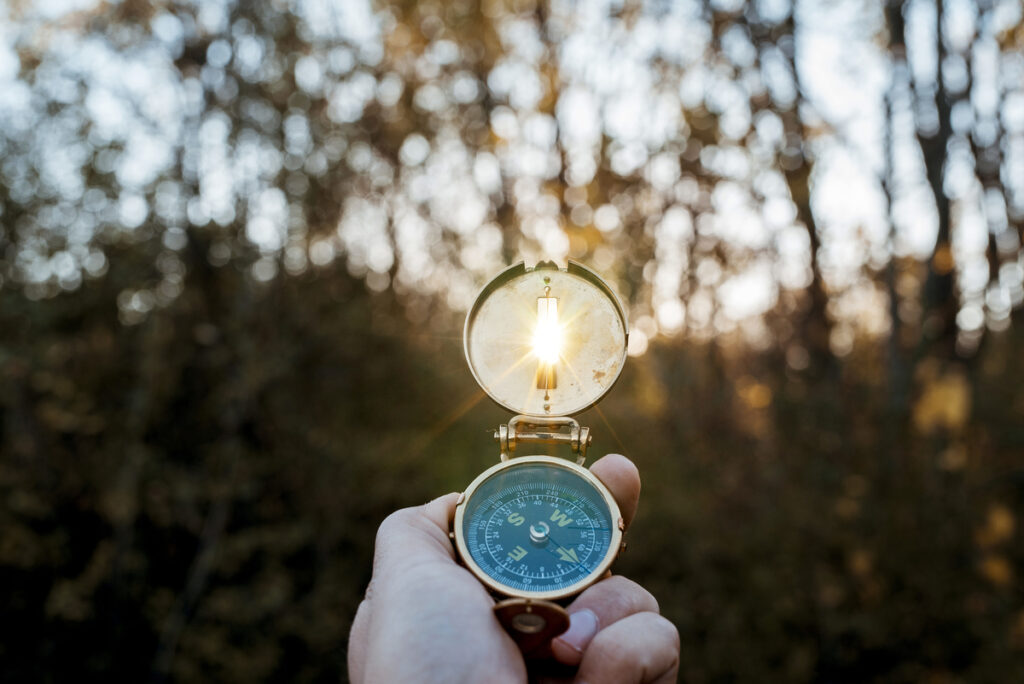 Compass pointing toward the light, symbolizing the search for truth and the question “Is the Bible true.”