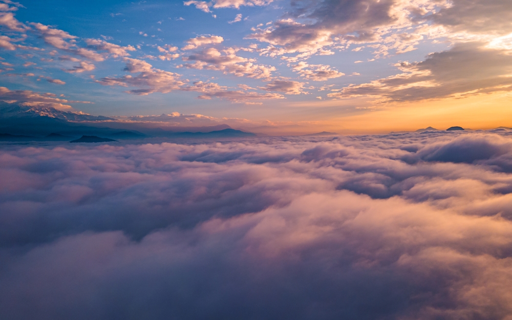 The sky and mountains and clouds at sunset